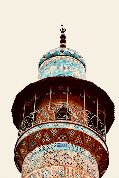 A tower with a mosaic design on it
