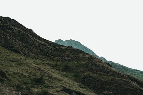 View of Rocky Mountains under Gray Sky 