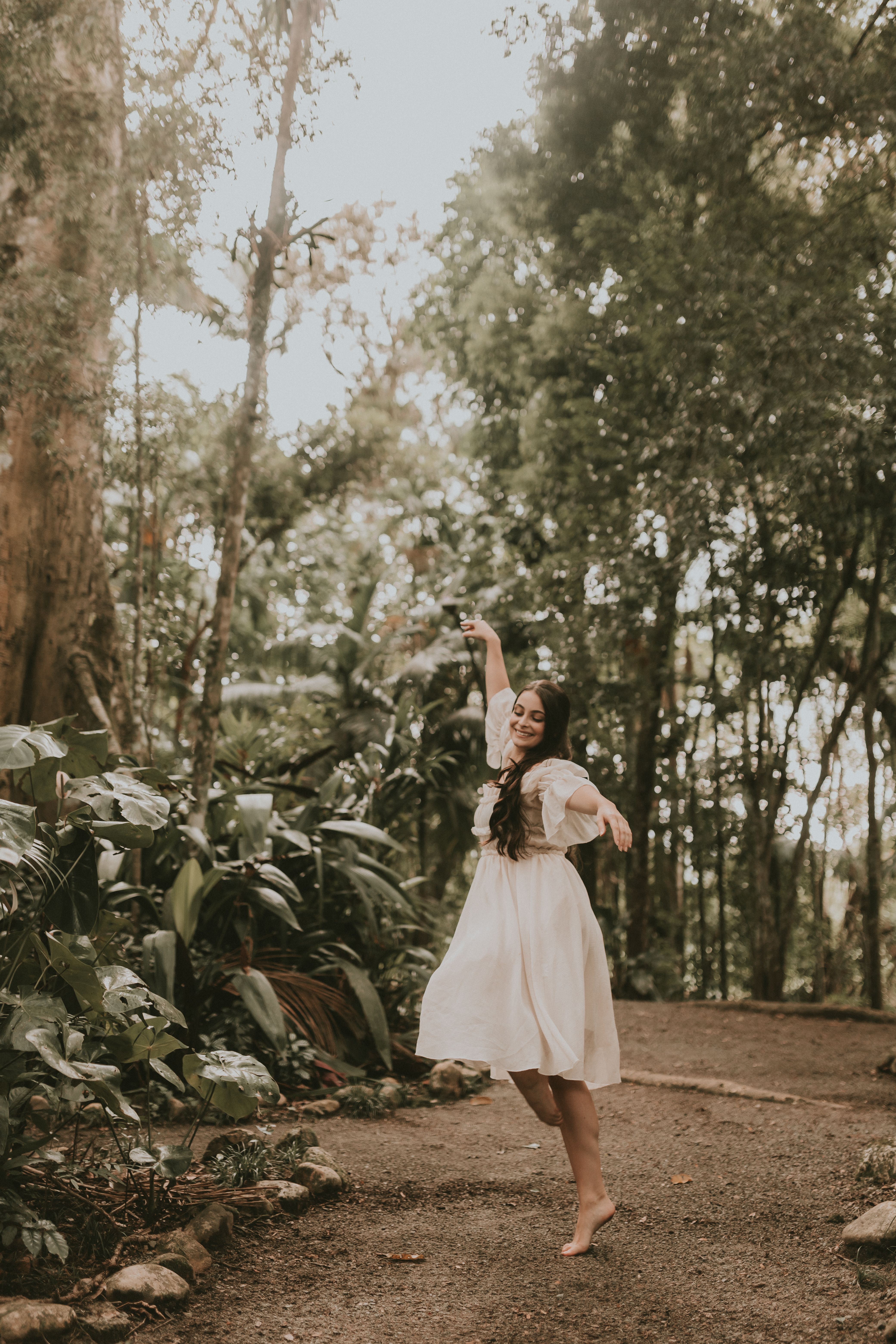 Woman in White Dress Dancing in the Park · Free Stock Photo