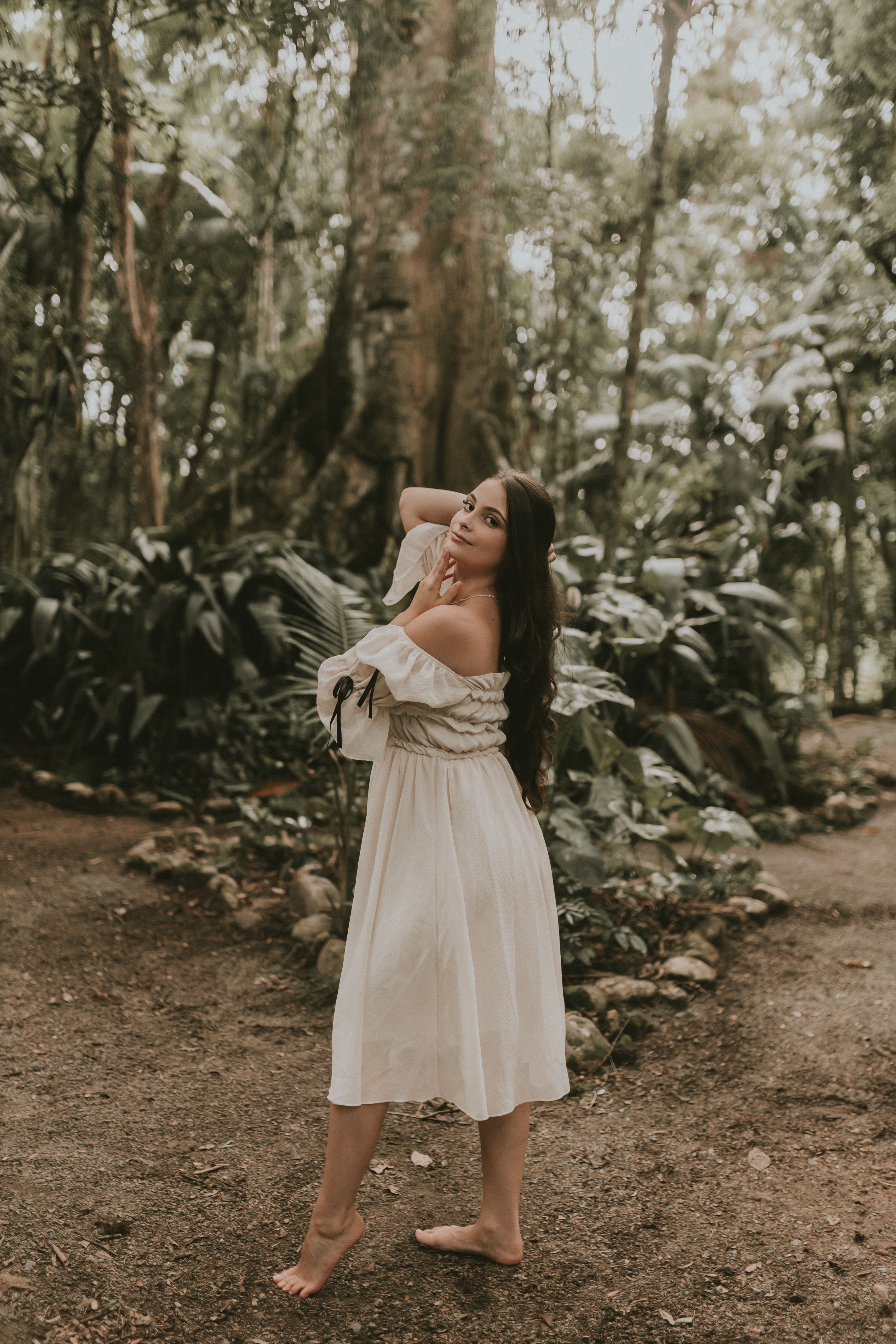 Young Woman in a Dress Posing in a Forest · Free Stock Photo
