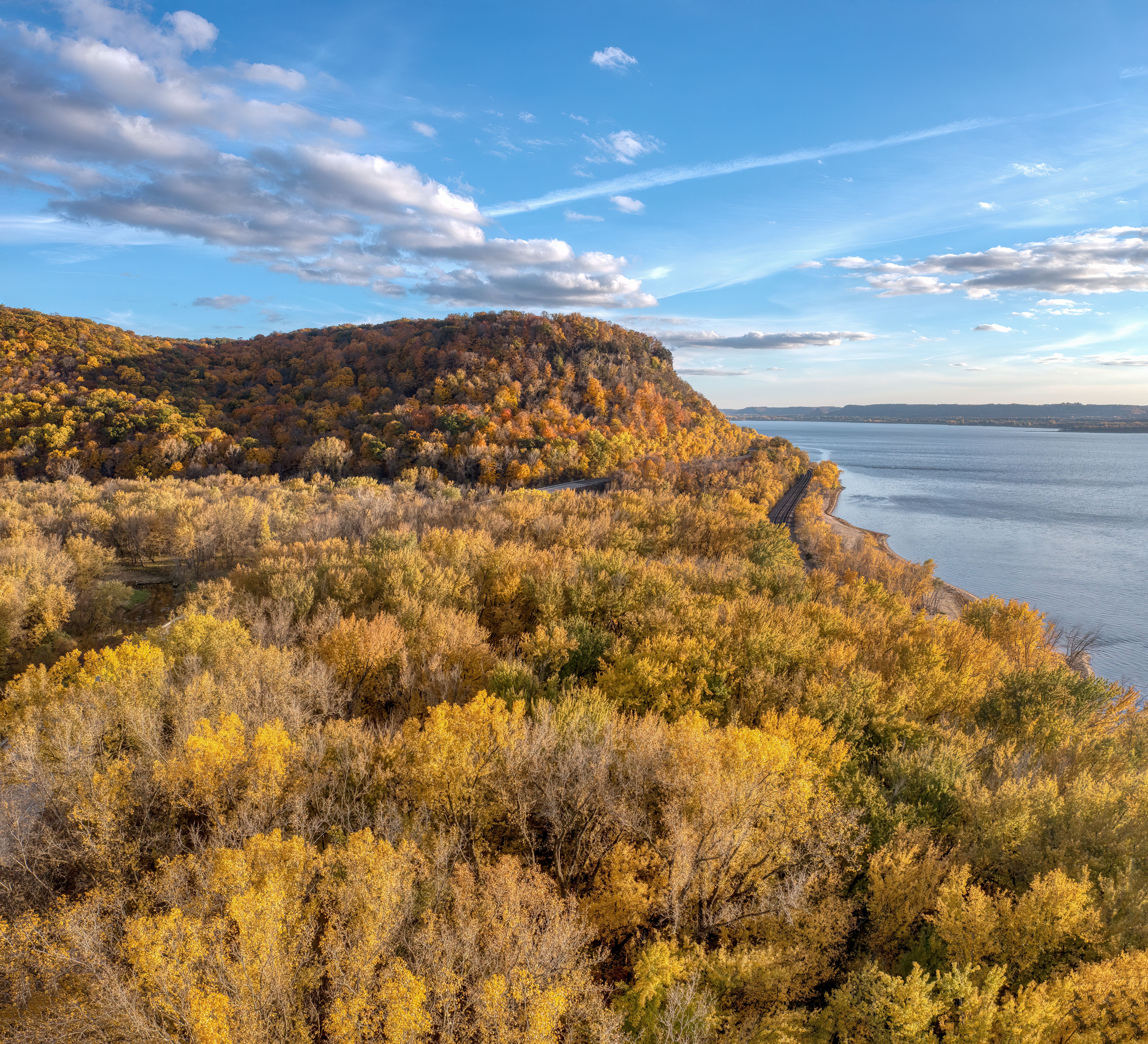 Beautiful fall foliage in Stockholm, WI with a stunning view of Lake Pepin and colorful forests.