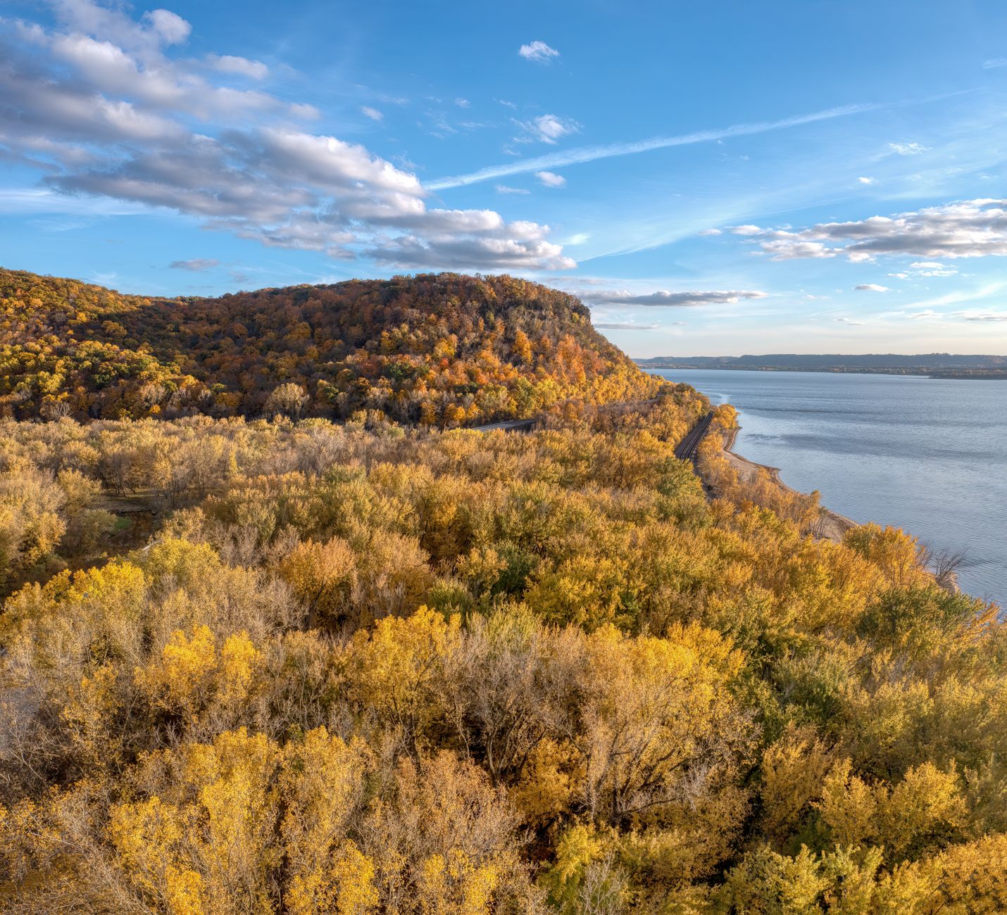 Beautiful fall foliage in Stockholm, WI with a stunning view of Lake Pepin and colorful forests.