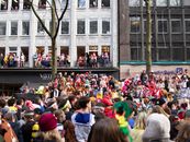 Vibrant carnival parade crowd celebrating in Cologne with costumes and festivities.