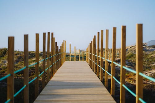 A wooden walkway leading to the beach