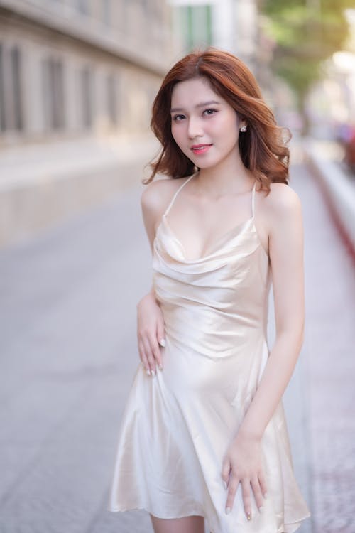 Woman in White Mini Silk Dress