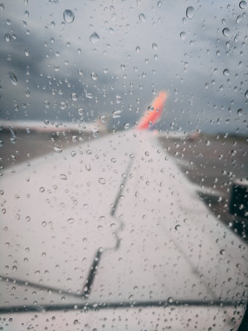 Free stock photo of aircraft wing, rain, southwest