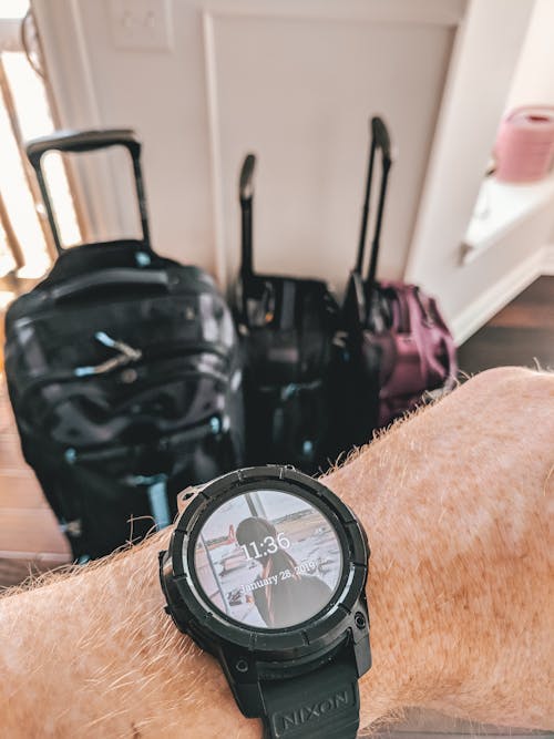 Free stock photo of hand, luggage, smartwatch