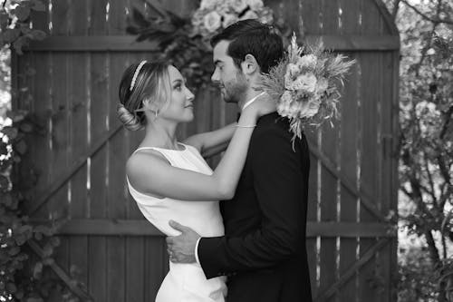 Elegant Newlyweds Embracing at Wedding