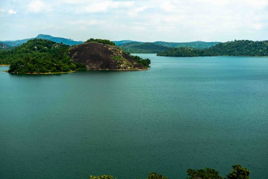 Breathtaking view of a lush island and calm waters in Abuja, perfect for relaxation and nature lovers.