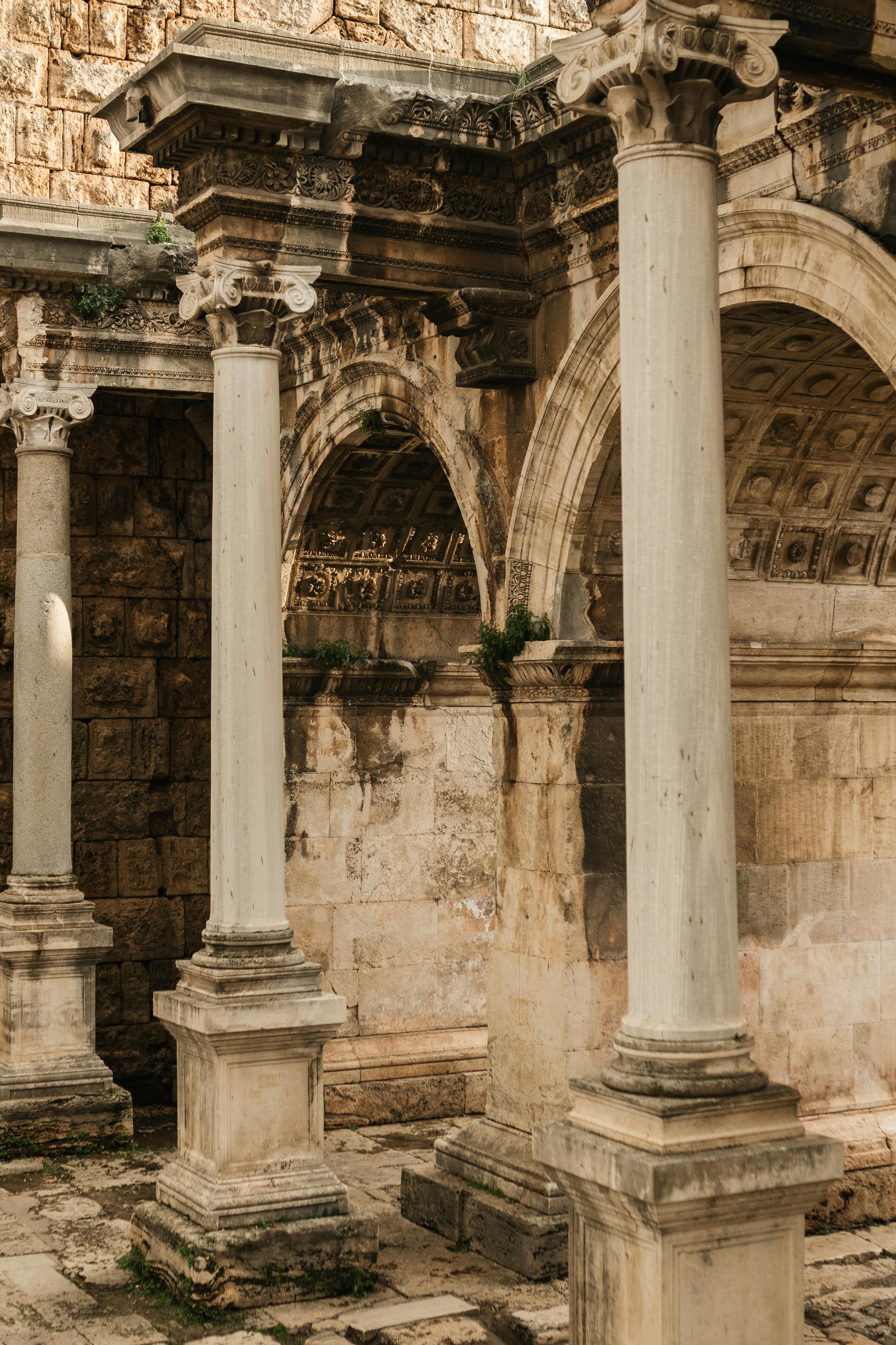 Stunning columns and arches of Hadrian's Gate in Antalya, Turkey, showcasing ancient Roman architecture.