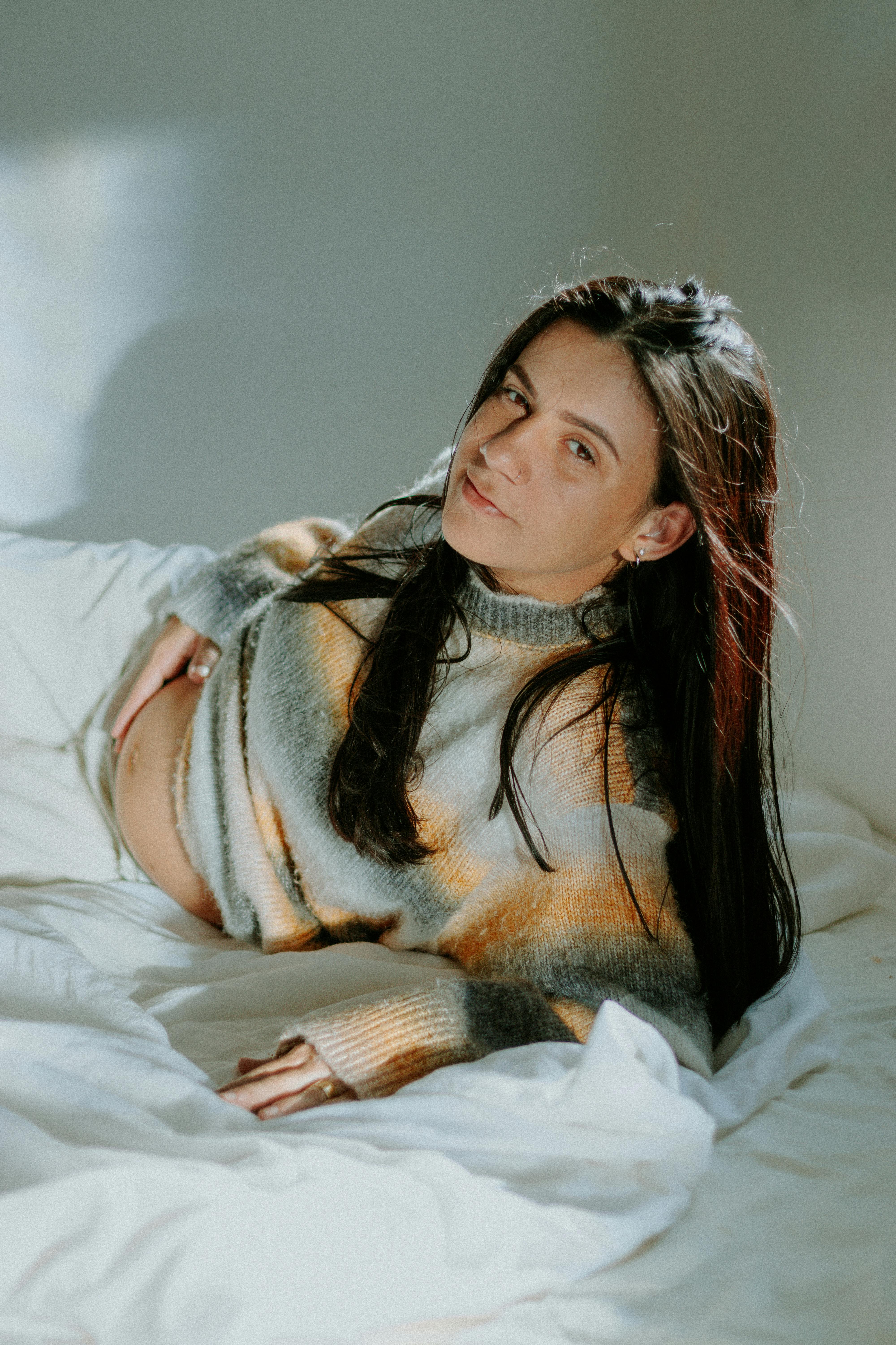 model in sweater lying down