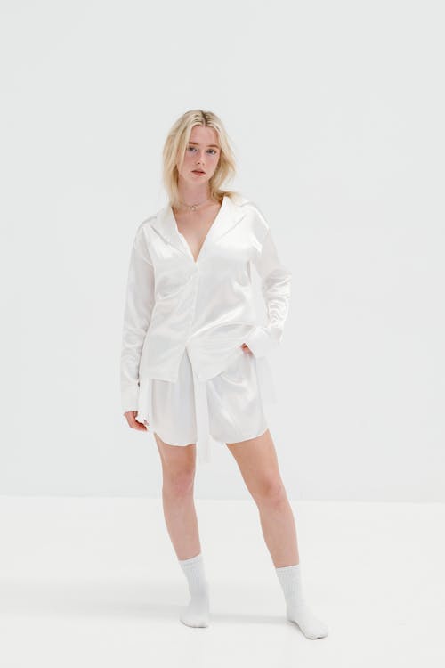 Female Model Wearing a Nightdress Standing against a White Background