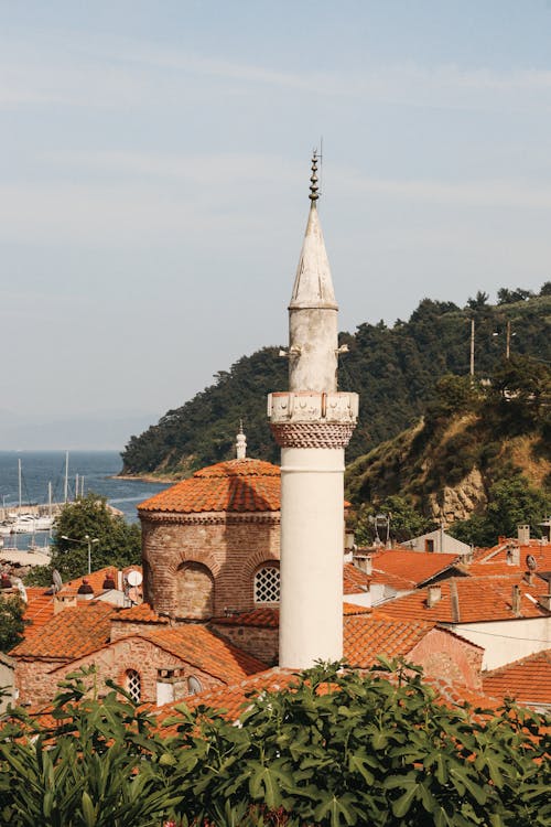 The view of a mosque and the sea from a hilltop