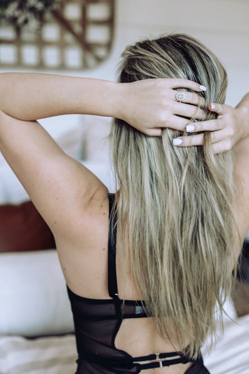 Blonde Woman Fixing Hair