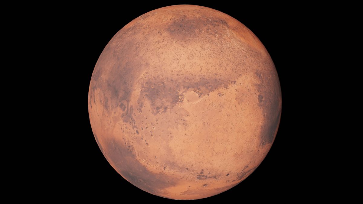 Mars, the red planet, half-lit against black space