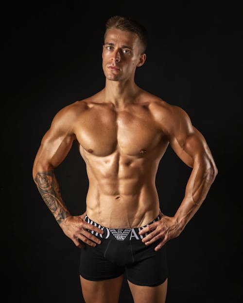 A man in black underwear posing for a photo