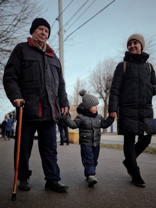 Mother and Grandpa Walking with Boy