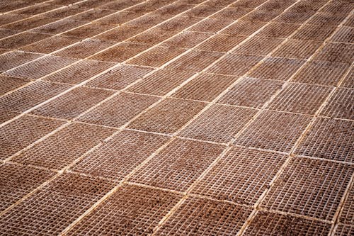 A close up of a brown tile floor