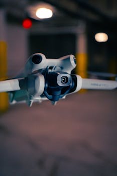 A detailed close-up of a modern drone indoors, highlighting advanced technology.