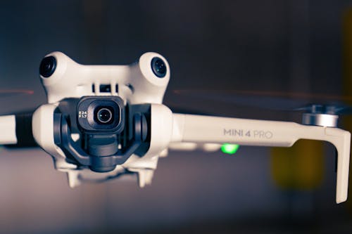 A close up of a white drone with a camera