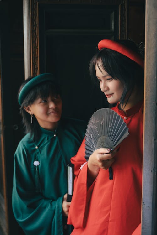 Women Standing in Traditional Clothing