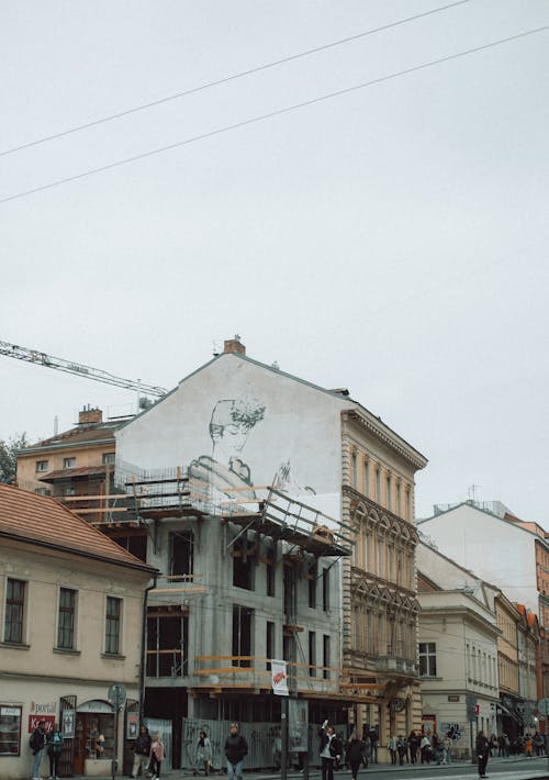 View of Pedestrians Walking near Buildings in City 