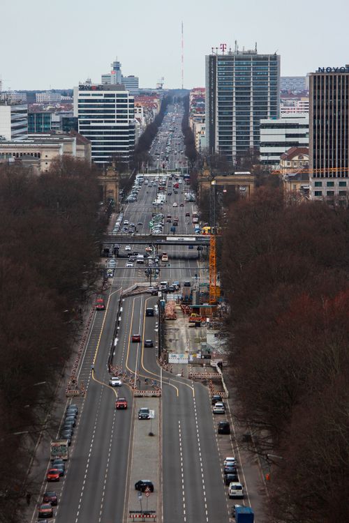 Free A bustling city street in Berlin showcasing modern architecture and heavy traffic. Stock Photo