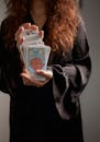 Close-up of a Woman Holding a Deck of Tarot Cards