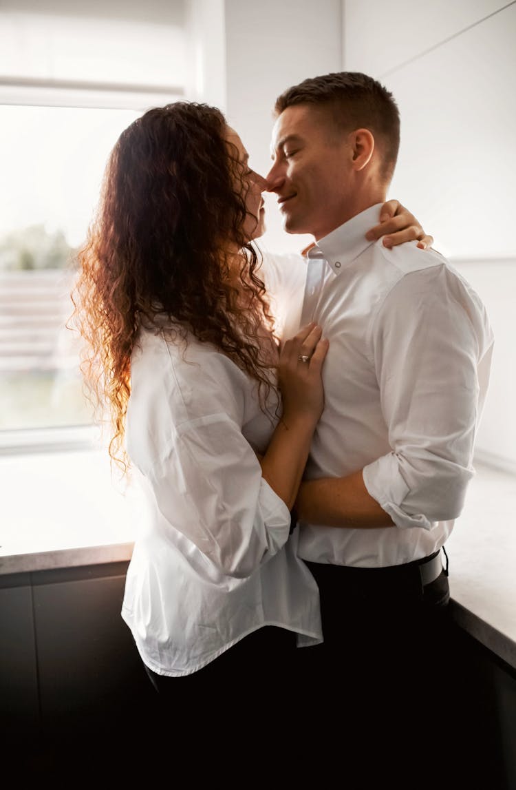 Hugging Couple In Kitchen