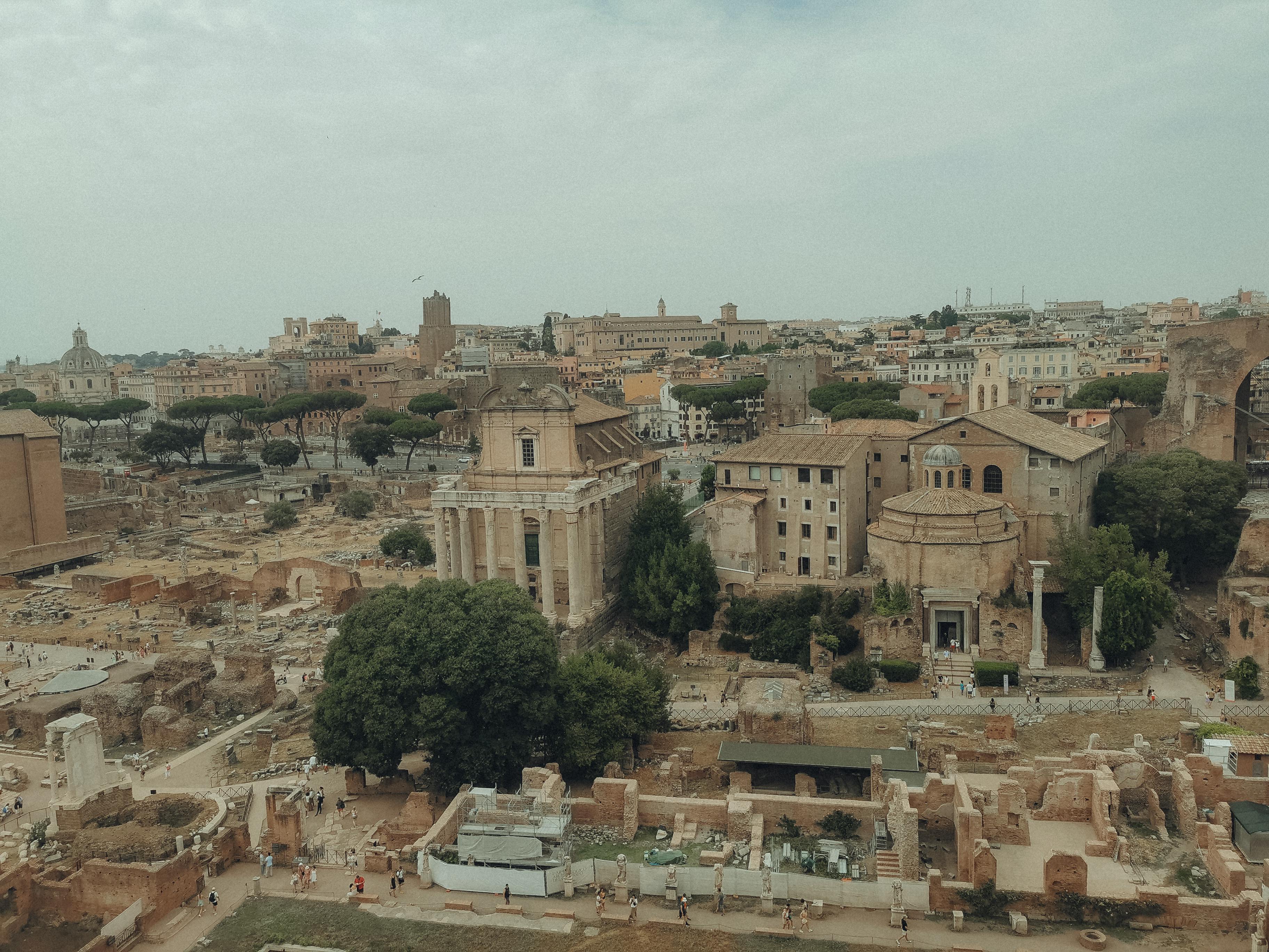 Aerial view of the ancient Roman Forum ruins in Rome, a symbol of historical architecture.