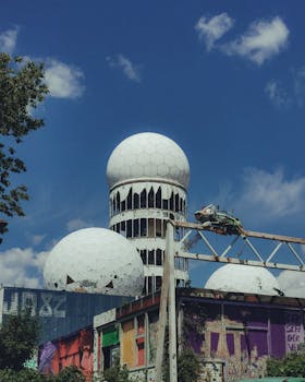 Abandoned Cold War listening station in Berlin, featuring iconic radar domes and street art.