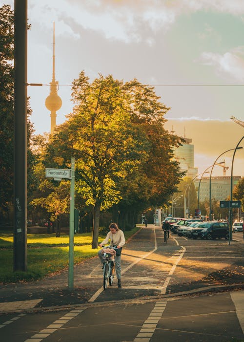 Woman on Bicycle in Berlin at Sunset