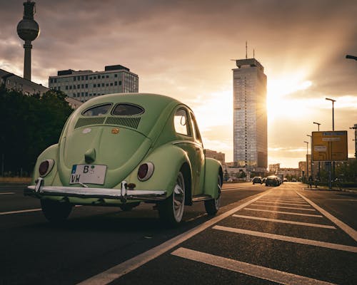 Vintage Volkswagen Beetle on Street in Berlin at Sunset