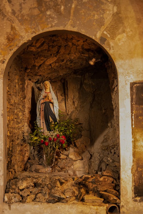 Virgin Mary Statue in Ruined Wall