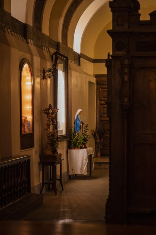 Statue of Virgin Mary on Table in Church