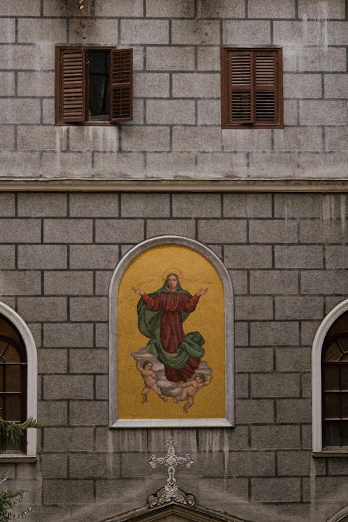 A painting of jesus on the side of a building
