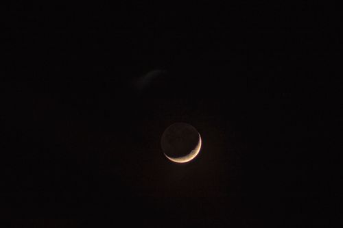 Free Captivating crescent moon shining brightly against a deep black night sky, perfect for celestial enthusiasts. Stock Photo