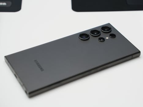 Detailed close-up shot of a sleek Samsung smartphone highlighting its advanced camera lenses.
