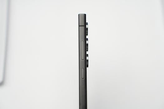 Minimalist side profile shot of a modern slim smartphone highlighting its camera lenses.