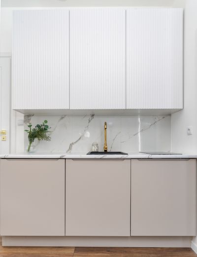 Pale minimal kitchen interior — photo by Mateusz Pielech on Pexels