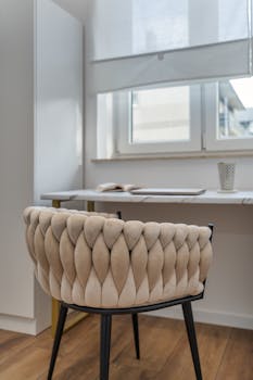 Stylish velvet chair in a modern office setting with natural light.