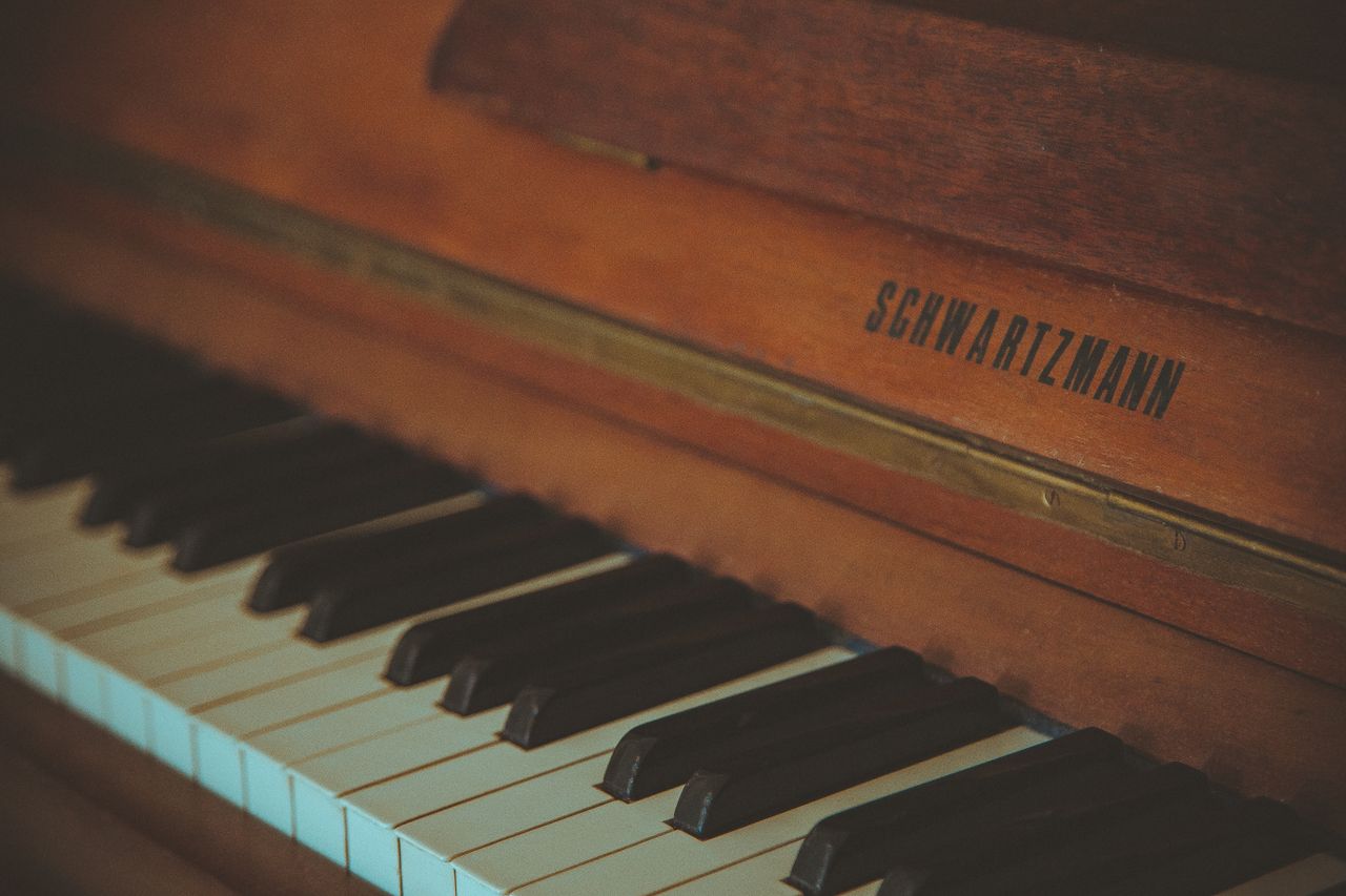 close up of a vintage schwartzmann piano showcasing its classic wooden