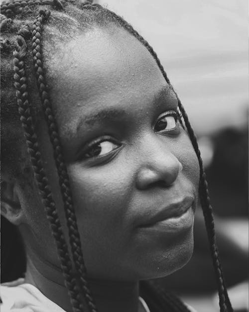 Close Up of a Woman Wearing Braids