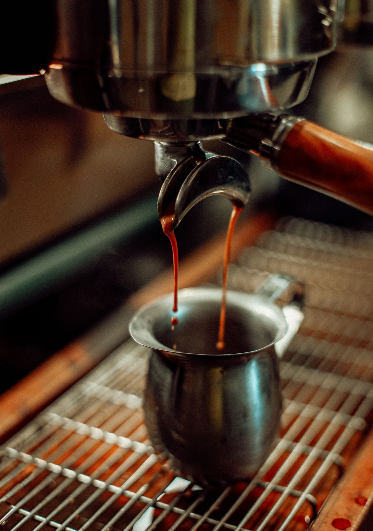 Commercial-style espresso machine pouring a shot, for illustration