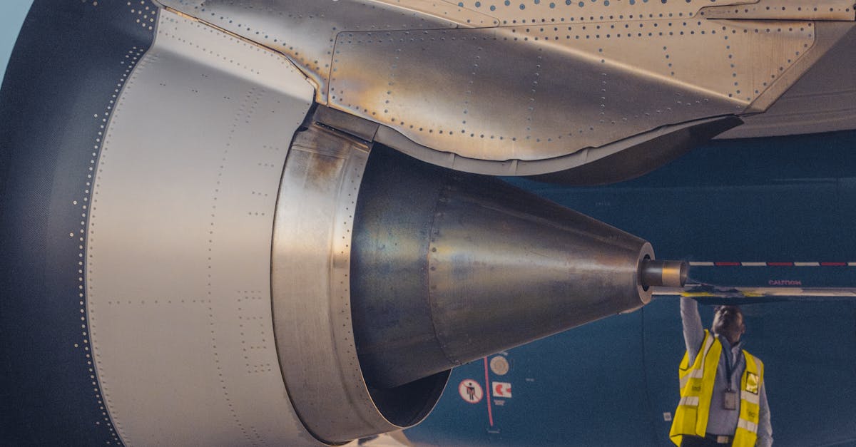 Man Checking Airplane Engine · Free Stock Photo