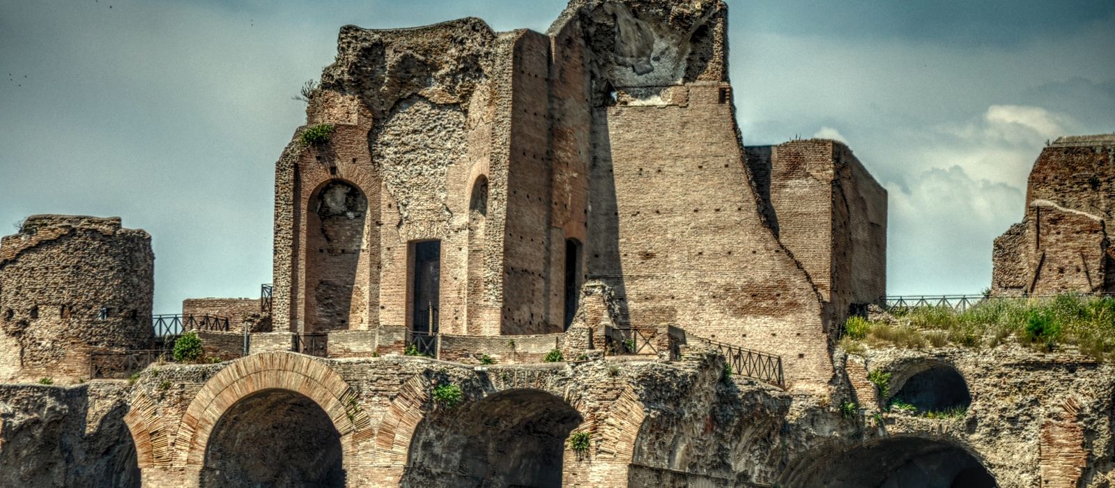 Explore the ancient ruins of the Domus Flavia in Rome, showcasing historic architectural beauty.