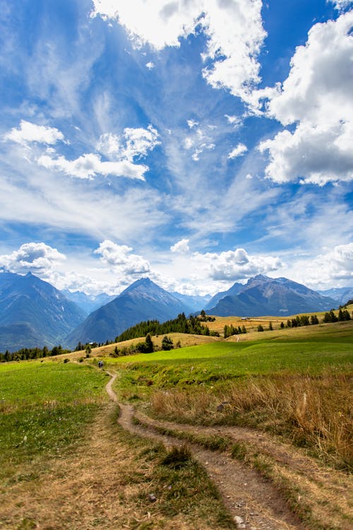 Rural Road across Fields in Mountains