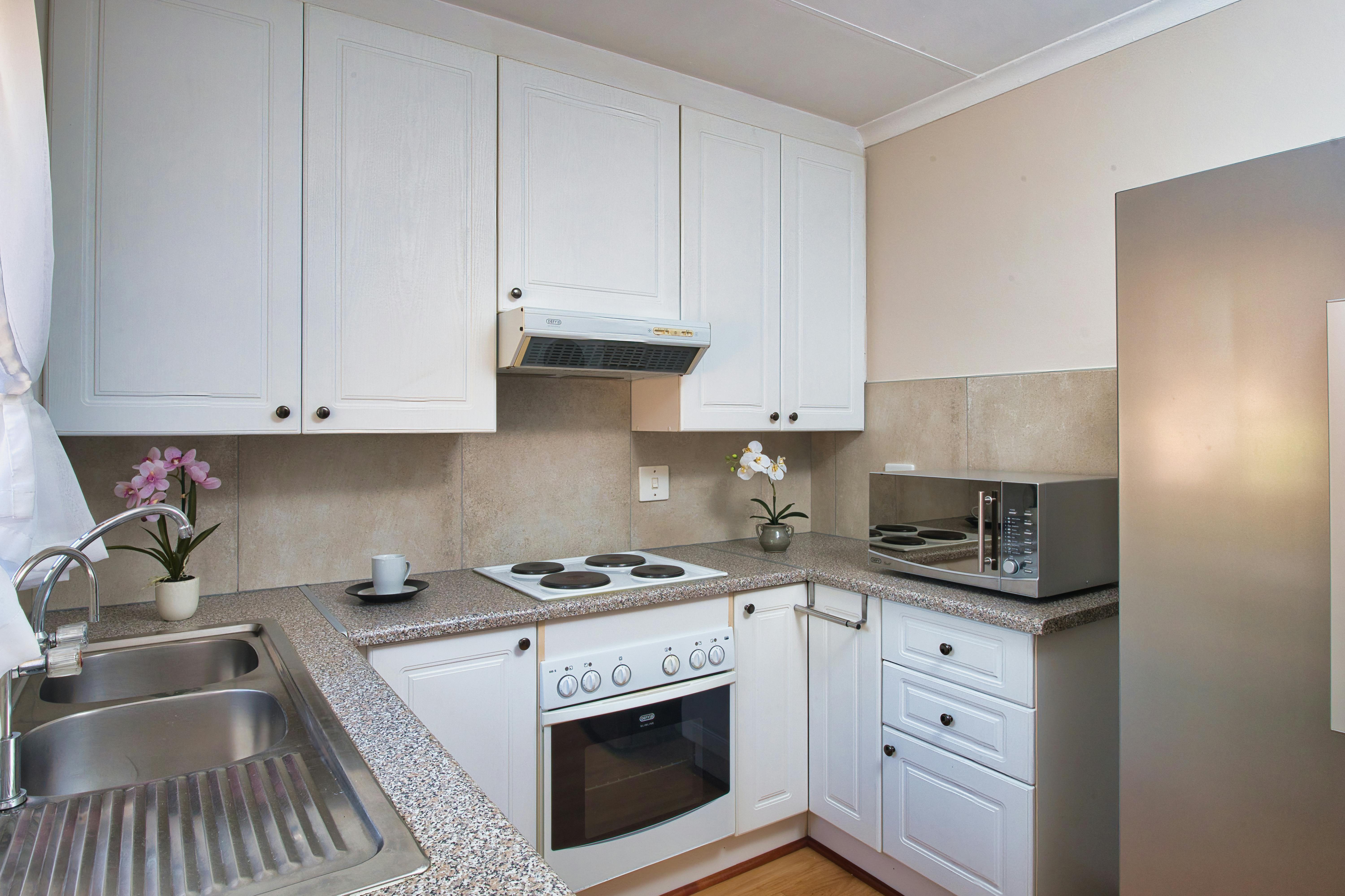 Contemporary kitchen with well-organized cabinets