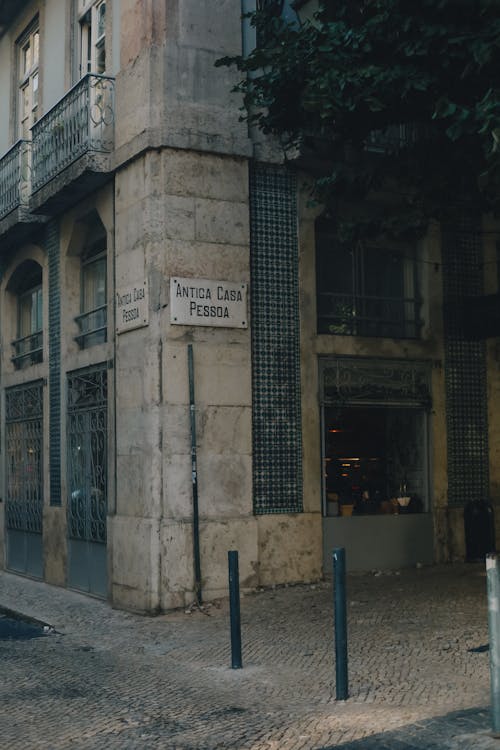 Facade of a Historical Building and a Paved Street in Lisbon 