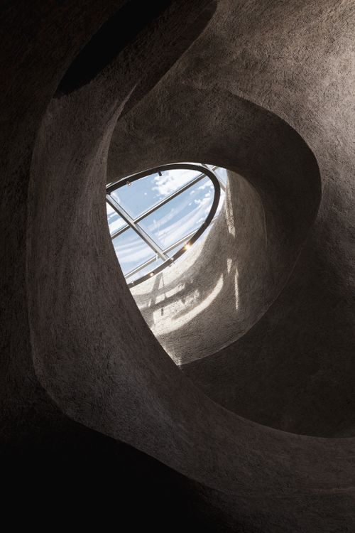 Free Curved architecture framing a skylight, capturing light and shadow play. Stock Photo